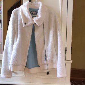 White furry jacket